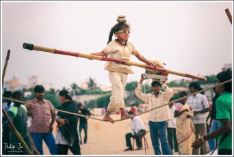 An Indian Street Artist Performs an act of Tightrope Walking