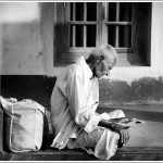 An Old Man Reads a Panchanga