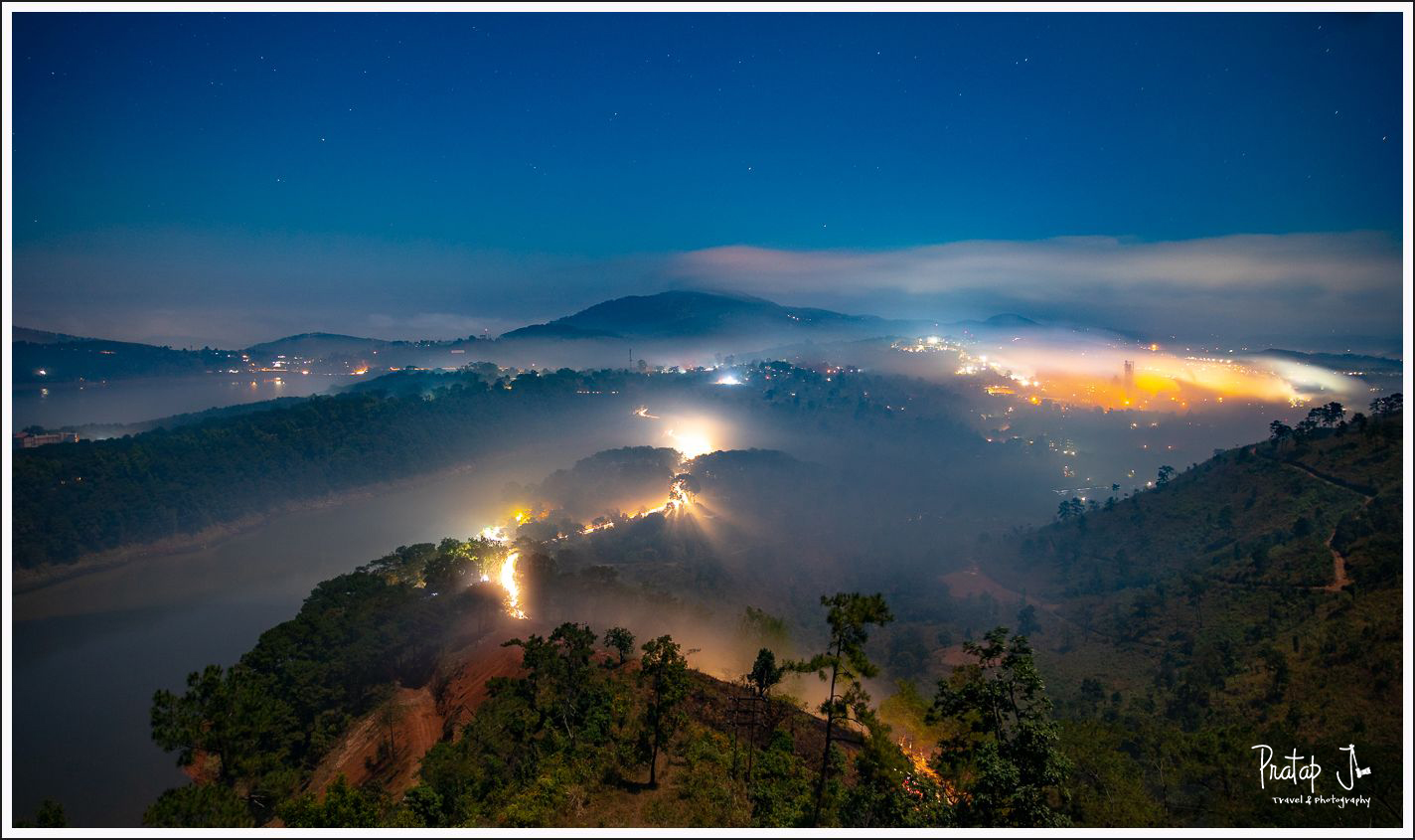 a blue hour photo of the city of Shillong and umiam lake