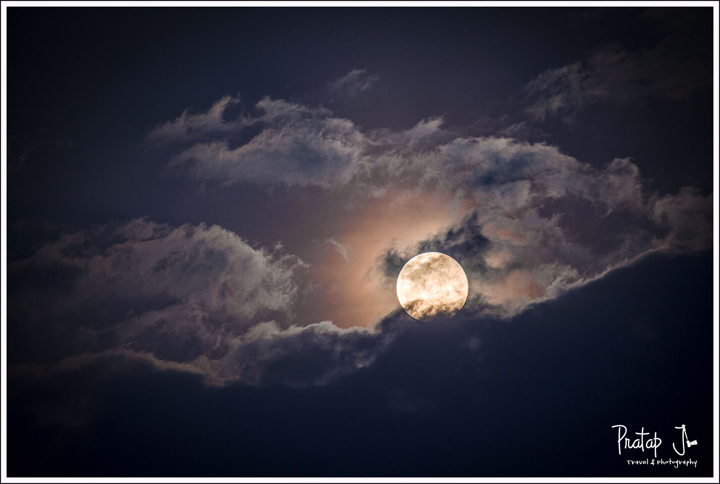Moon peeping through the clouds