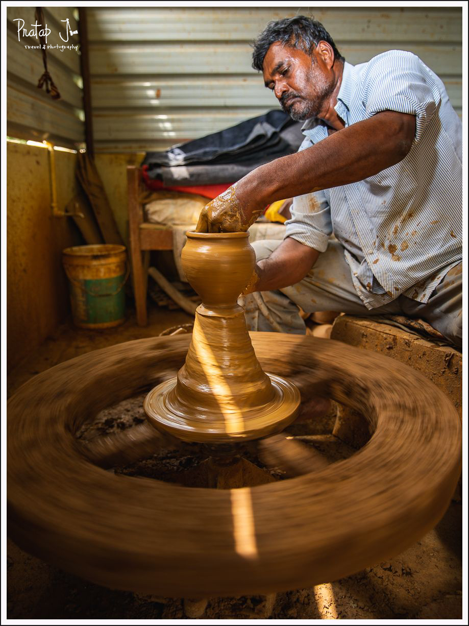 Portrait of a potter and his pottery wheel