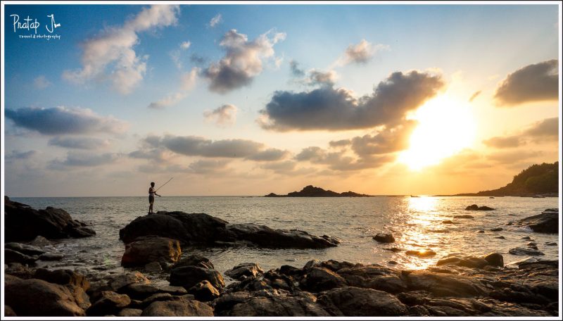 Man Fishes in the Beach at Sunset