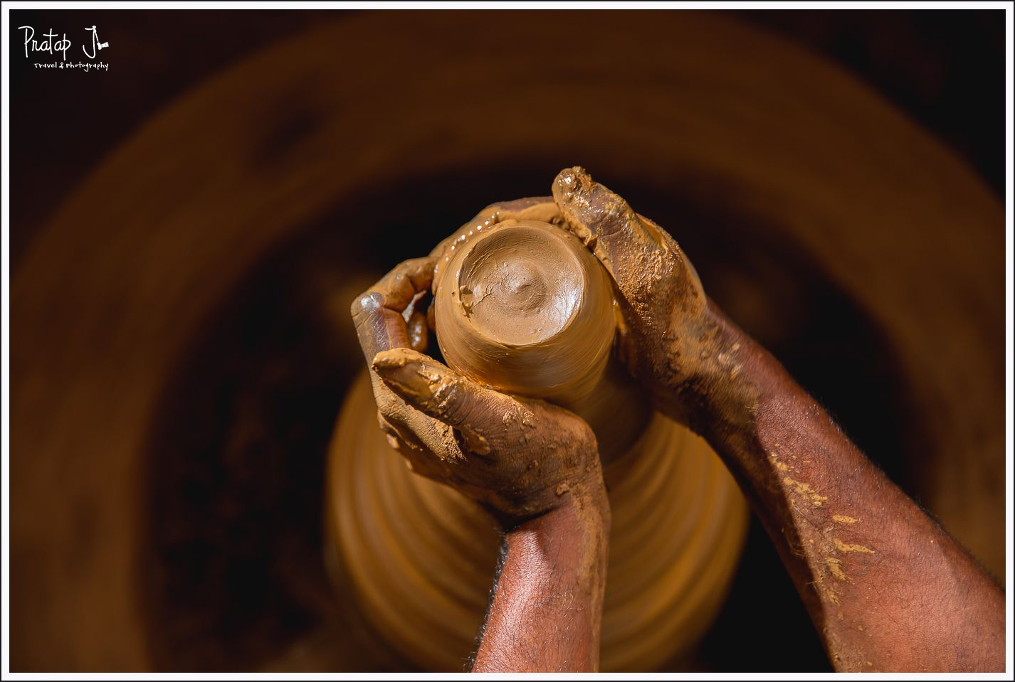 Top view of a potter starting to make a clay pot