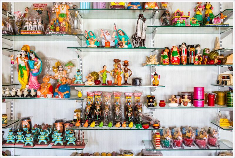 Shelf full of various wooden toys at Channapatna factory