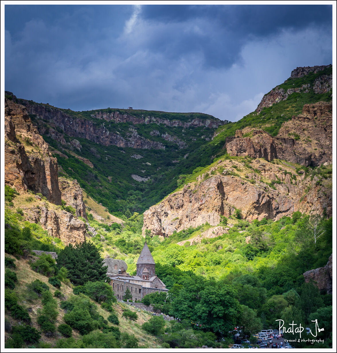A view of geghard monastery in between mountains