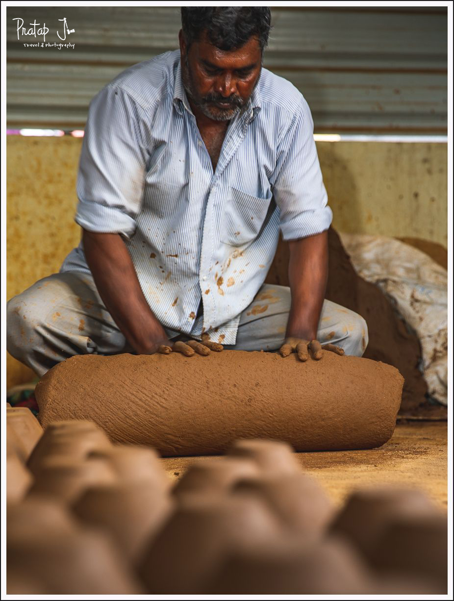 A potter kneading clay from the river bed