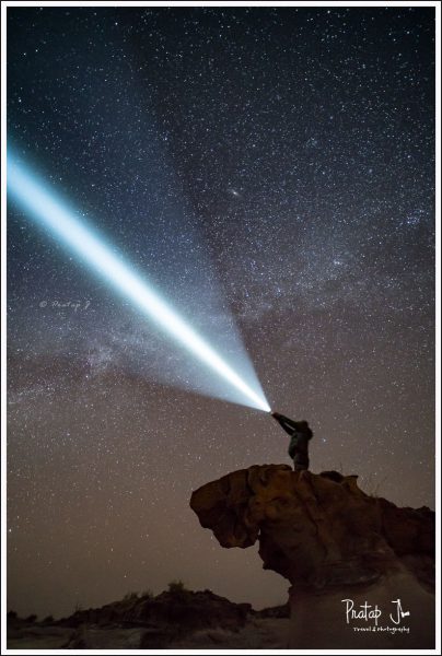 Man Holding a Light Sabre Against the Sky in Kutch